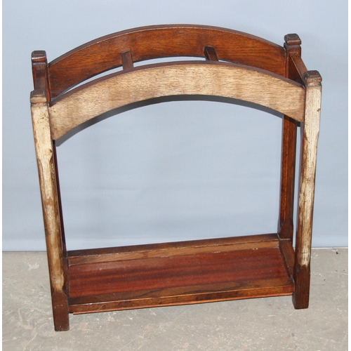 11 - An early 20th century oak stick stand, approx 60cm wide