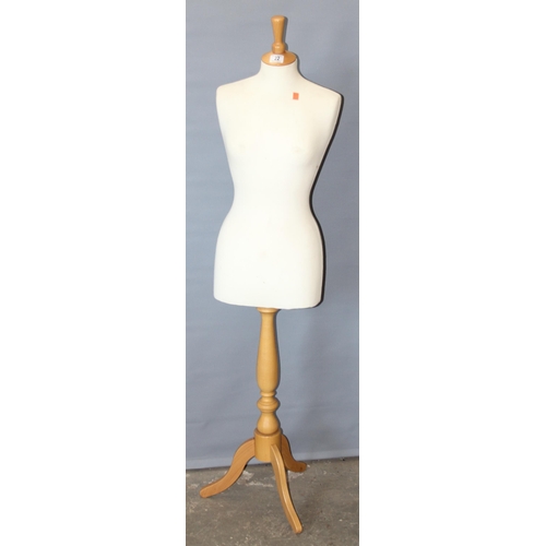 22 - A life size female mannequin on wooden base