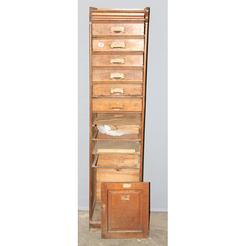 24 - A large early 20th century set of oak filing drawers, some drawers missing, approx 179cm tall x 43cm... 