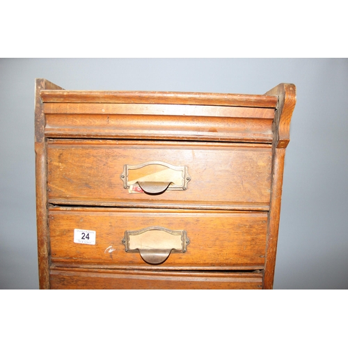 24 - A large early 20th century set of oak filing drawers, some drawers missing, approx 179cm tall x 43cm... 