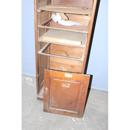 24 - A large early 20th century set of oak filing drawers, some drawers missing, approx 179cm tall x 43cm... 