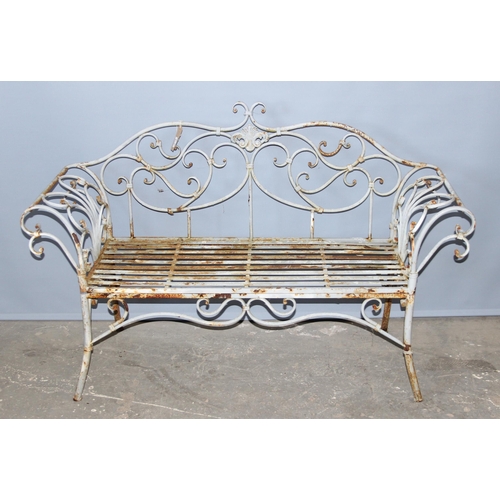 301 - An antique style painted distressed wrought iron garden bench, approx 140cm wide