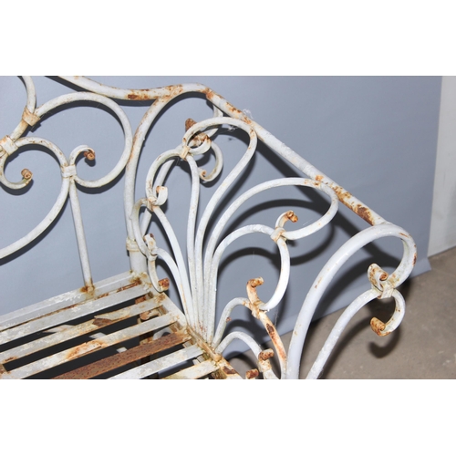 301 - An antique style painted distressed wrought iron garden bench, approx 140cm wide