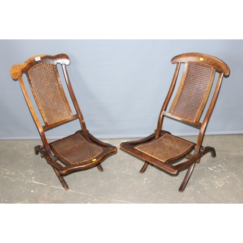 4 - A matched near pair of late 19th or early 20th century folding campaign chairs with Bergere seats an... 