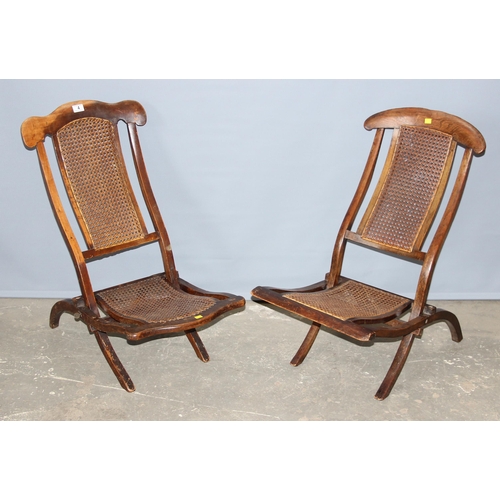 4 - A matched near pair of late 19th or early 20th century folding campaign chairs with Bergere seats an... 