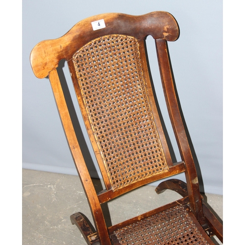 4 - A matched near pair of late 19th or early 20th century folding campaign chairs with Bergere seats an... 