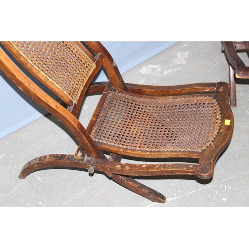 4 - A matched near pair of late 19th or early 20th century folding campaign chairs with Bergere seats an... 