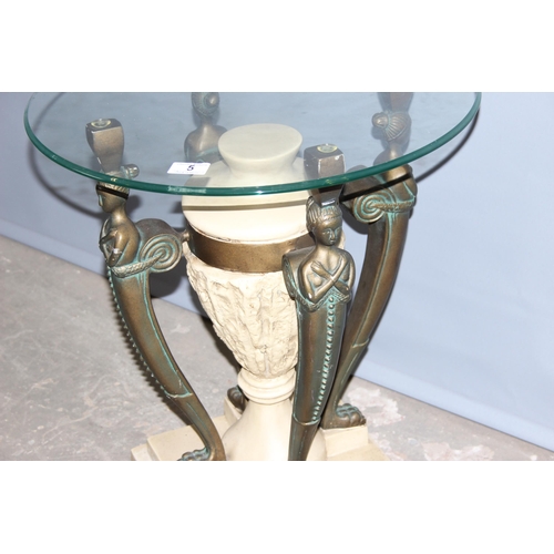 5 - An Egyptian style glass topped pedestal or side table decorated with bronzed figural struts, the top... 