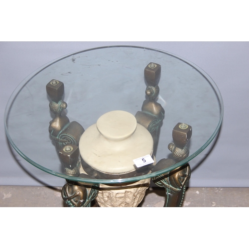 5 - An Egyptian style glass topped pedestal or side table decorated with bronzed figural struts, the top... 