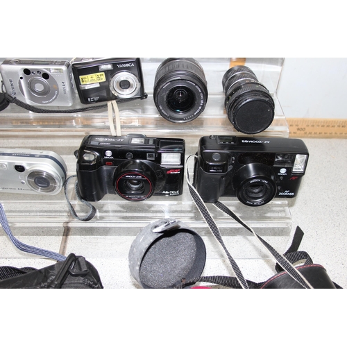 650 - Mixed lot of vintage cameras and lenses to include Canon sureshot, HP photo smart 945 & Samsung slim... 