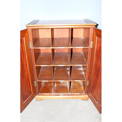 8 - An early 20th century mahogany pigeon hole alphabetical filing cabinet with inlaid doors, approx 67c... 