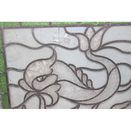 363 - 2 early 20th century leaded stained glass windows depicting mythical sea beasts, each approx 44cm x ... 