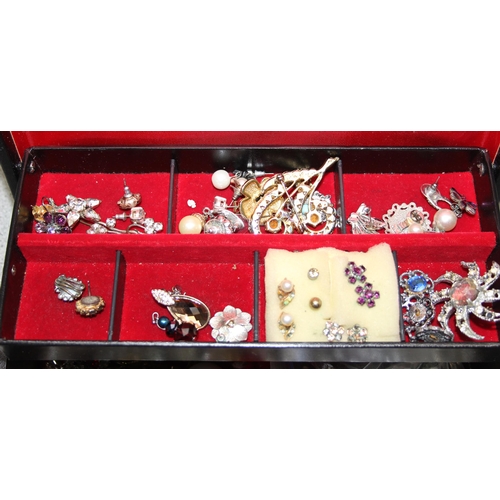 1110 - Black jewellery box with contents, mainly earrings & brooches