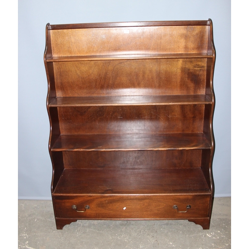 29 - An antique style mahogany waterfall bookcase with 2 drawers, approx 122cm wide