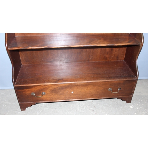 29 - An antique style mahogany waterfall bookcase with 2 drawers, approx 122cm wide