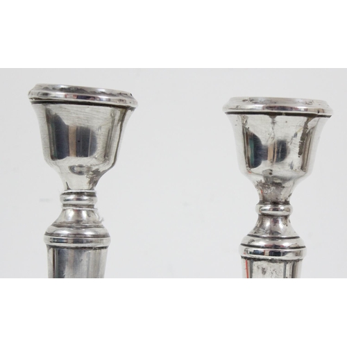 1028 - A pair of silver candlesticks, Birmingham 1972 by AT Cannon Limited, each approx 21cm tall