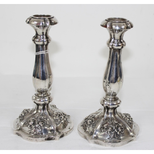 1029 - A pair of mid-19th century Austrian silver candlesticks with embossed floral decoration, each approx... 