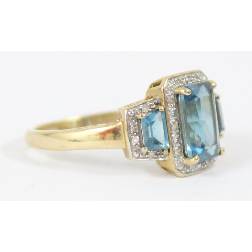 1102 - An impressive Art Deco style cocktail ring set with 3 large aquamarine coloured stones and surrounde... 