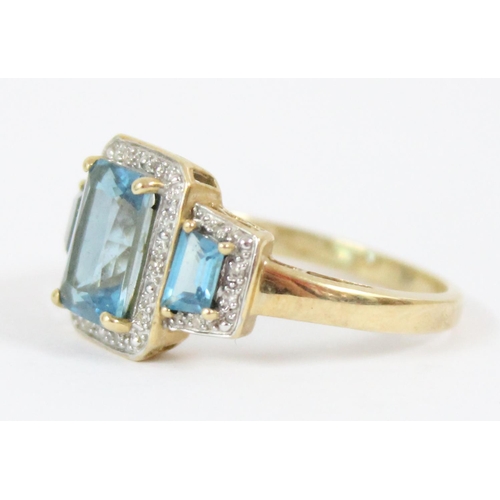 1102 - An impressive Art Deco style cocktail ring set with 3 large aquamarine coloured stones and surrounde... 