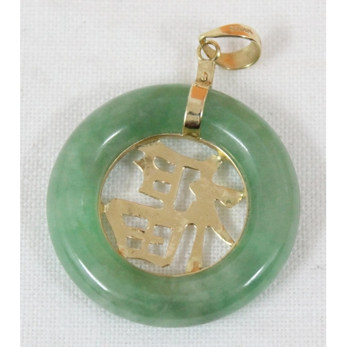 1113 - A Chinese 14ct gold mounted and green jade circular pendant, marked 14k 585 and XRF tested to confir... 