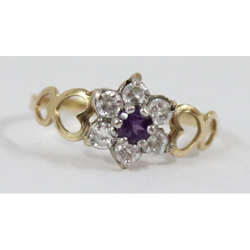 1114 - 9ct gold and floral set ring, approx size P, approx 1.05g gross