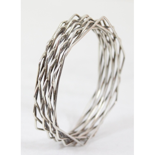 1119 - Bent Knudsen of Denmark, a retro Scandinavian mid-century silver bangle formed from a number offset ... 