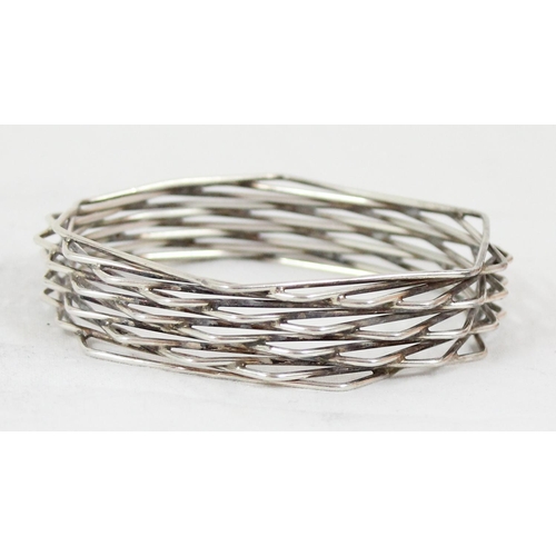 1119 - Bent Knudsen of Denmark, a retro Scandinavian mid-century silver bangle formed from a number offset ... 