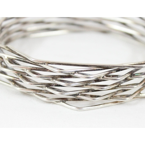 1119 - Bent Knudsen of Denmark, a retro Scandinavian mid-century silver bangle formed from a number offset ... 