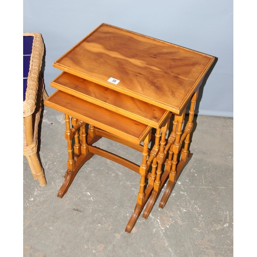 38 - A reproduction nest of 3 tables and a wickerwork tile topped side table (2)