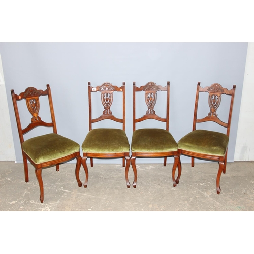 43 - A set of 4 antique chairs with stuffed seats and carved backs