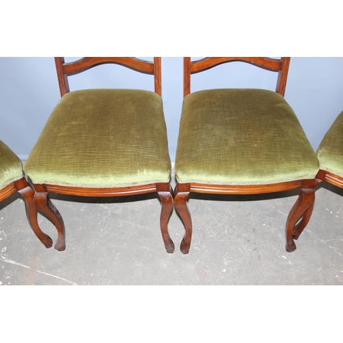 43 - A set of 4 antique chairs with stuffed seats and carved backs