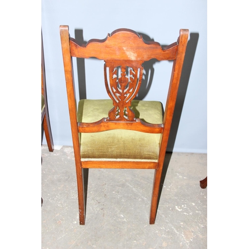 43 - A set of 4 antique chairs with stuffed seats and carved backs