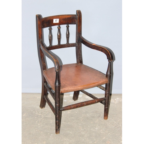 47 - A small antique child's chair with leather seat