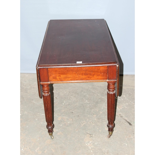 59 - An antique mahogany Pembroke table with reeded legs, single drawer and brass castors, approx 116cm w... 