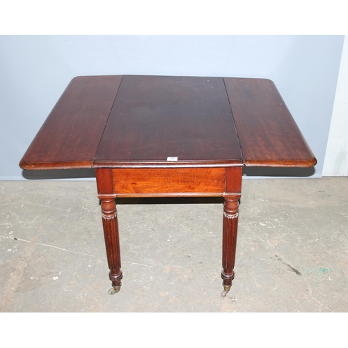 59 - An antique mahogany Pembroke table with reeded legs, single drawer and brass castors, approx 116cm w... 