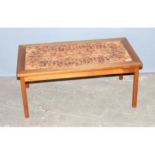 68 - A retro Danish tile topped coffee table, approx 93cm x 53cm