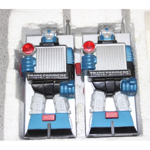 1540 - A pair of Transformers walkie-talkies & a Quick-Shot game