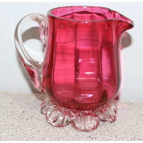 1627 - 3 pieces of antique cranberry glass, 2 mugs and a cream jug