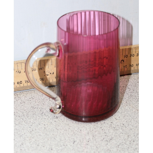 1627 - 3 pieces of antique cranberry glass, 2 mugs and a cream jug