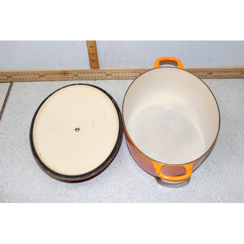 1781 - An orange oval Le Creuset cooking pan with lid, approx 35cm wide