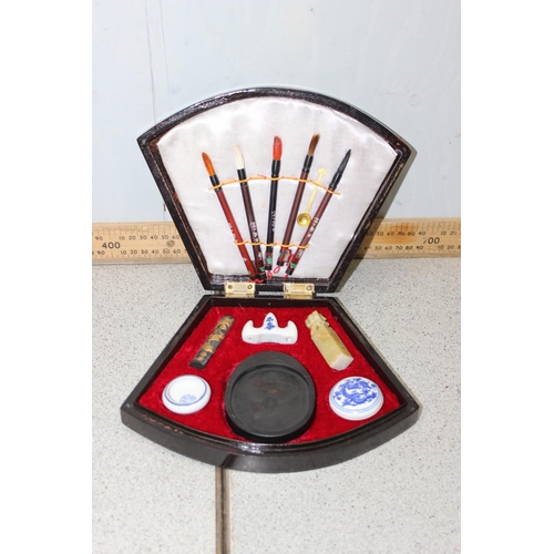 1801 - Chinese calligraphy set in fan shaped box, 2 sets of ebonised chop stick and hand painted lacquered ... 