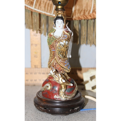 239 - A pair of turned wooden table lamps and Japanese pottery figural table lamp with shade (3)