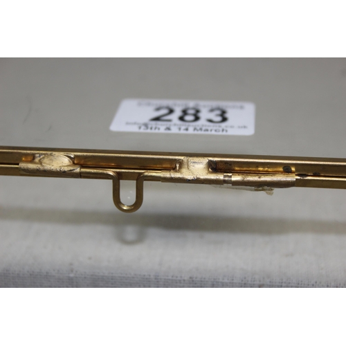 283 - A glazed table top display case with brass frame, approx 55cm x 26cm, ideal for antiques fairs