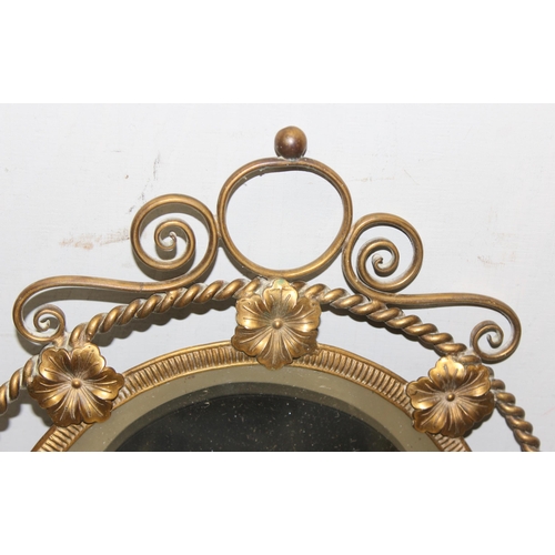 403 - Oval bevelled wall mirror with gilt wirework frame