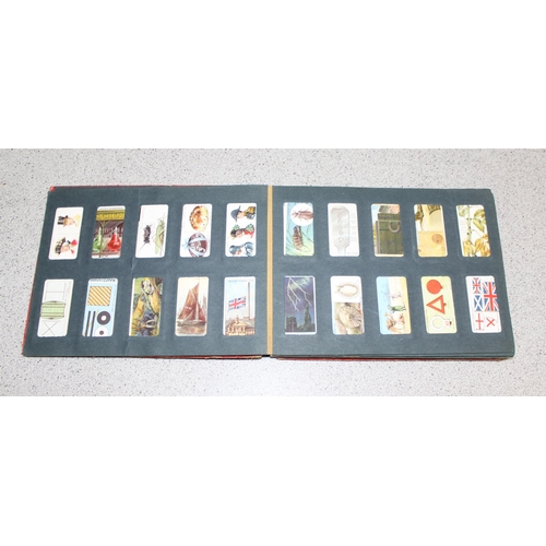 524 - Antique Wills cigarette card album approx 200 cards, some with military themes