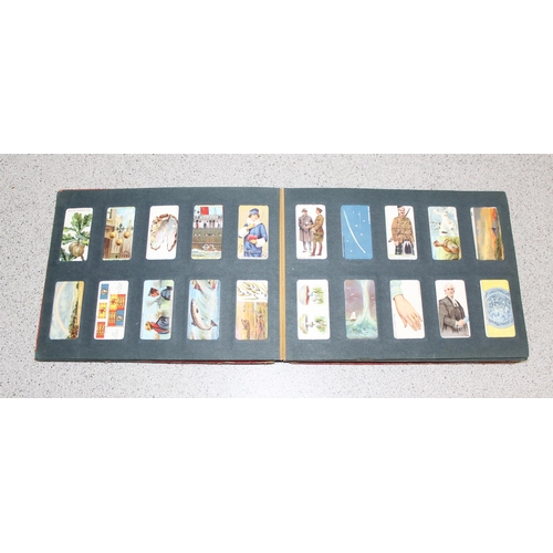 524 - Antique Wills cigarette card album approx 200 cards, some with military themes