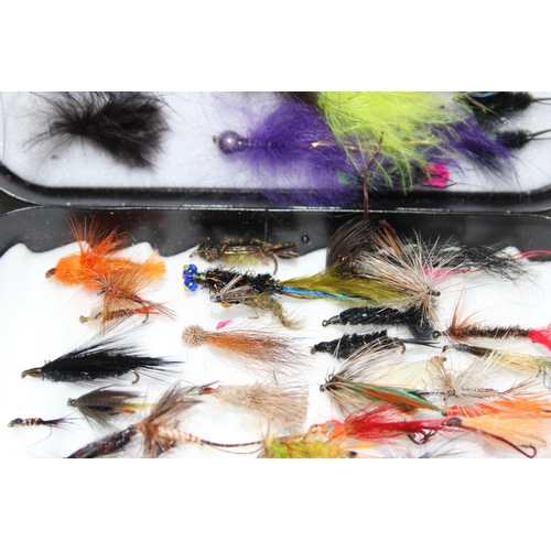 719 - 2 black Richard Wheatley fly boxes containing a good mix of salmon & trout flies