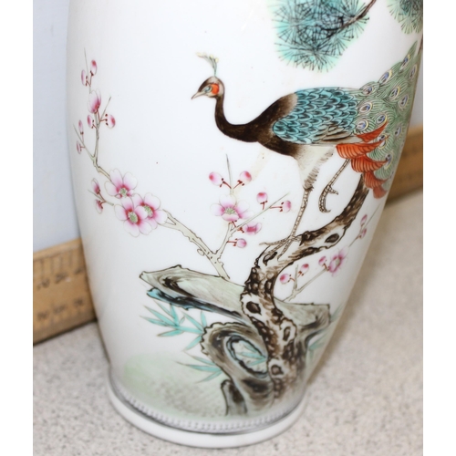 1810 - A Chinese porcelain vase decorated with a peacock, red seal mark to base