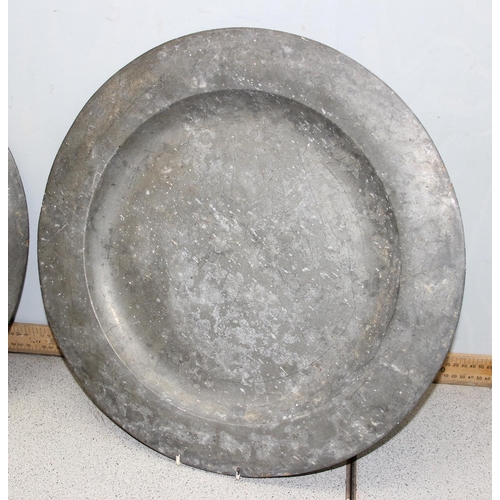 1024 - A pair of antique pewter chargers, approx 46cm in diameter, with marks verso likely signifying they ... 