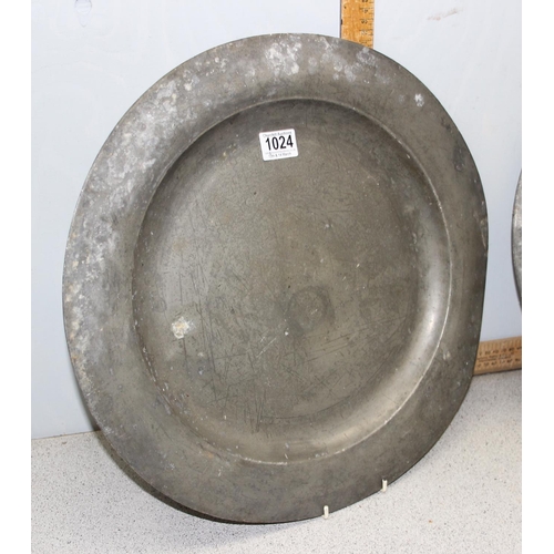 1024 - A pair of antique pewter chargers, approx 46cm in diameter, with marks verso likely signifying they ... 